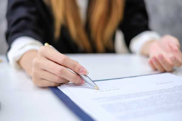 woman signing contract